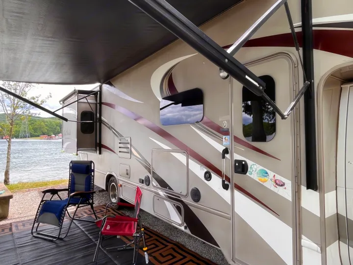 This RV rental is perfectly set up by a serene lake,. Thor Four Winds 2015