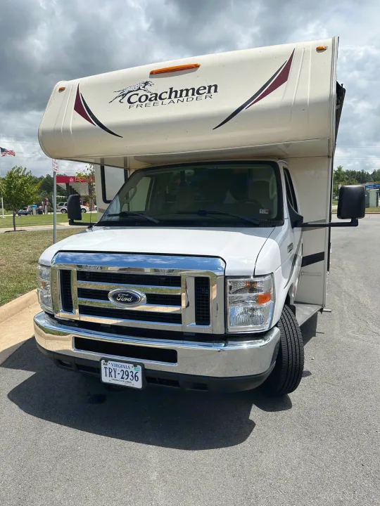 White Ford Class C Coachmen Freelander RV rental, front view, parked on asphalt.. Forest River Coachmen Freelander 2018