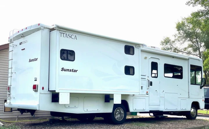 White Itasca Sunstar RV rental parked at a campsite, ready for your next adventure.. Itasca Sunstar 2008