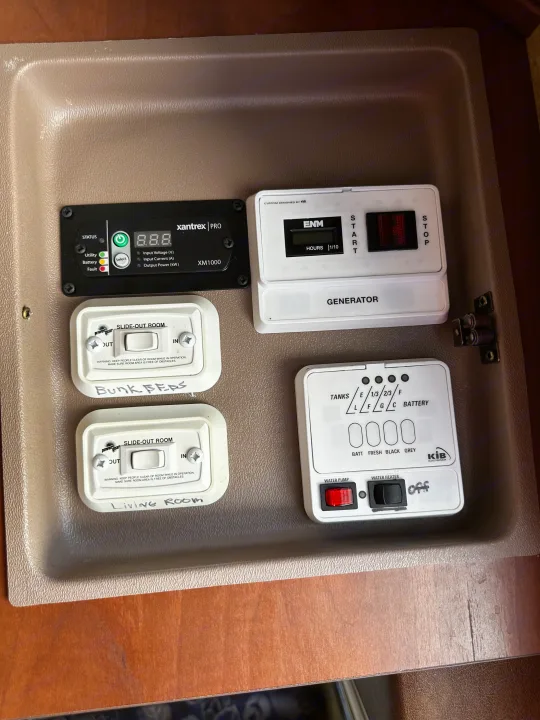 RV rental interior control panel: monitor generator, slide-outs, water pump, tank levels, battery inverter.. Jayco Greyhawk 2012