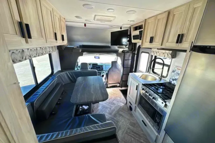 Modern RV rental with full kitchen, comfortable dinette, and bright living space. Ready for adventures!. Forest River Sunseeker LE 2022