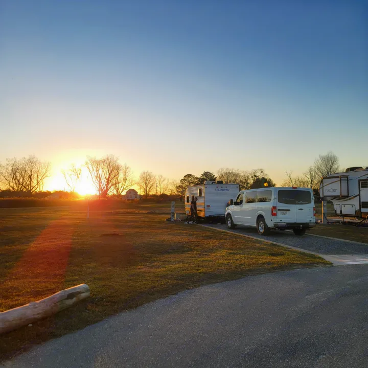 Exterior from a distance during a sunset in Alabama. Gulf Stream Enlighten 2021