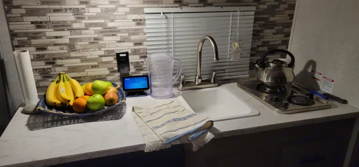 Interior shot of possible setup. Counter space, stove top and sink and the water kettle included and available for use. . Gulf Stream Enlighten 2021