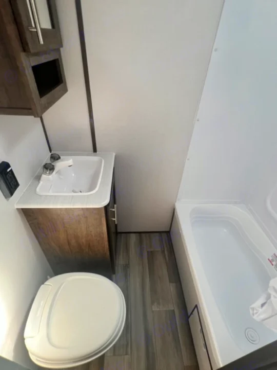 RV rental interior: a sleek, space-saving bathroom with a shower, toilet, and sink.. Riverside Retro 190BH 2023