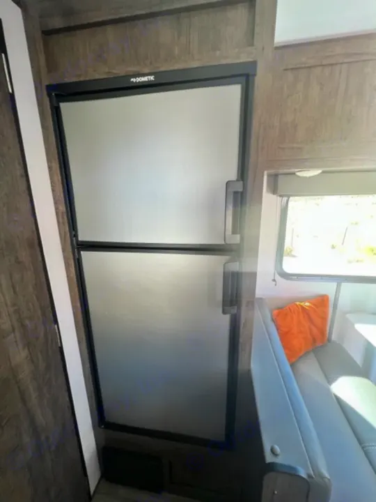 Compact Dometic fridges in an RV rental interior, perfect for food & drink storage on your road trip.. Riverside Retro 190BH 2023