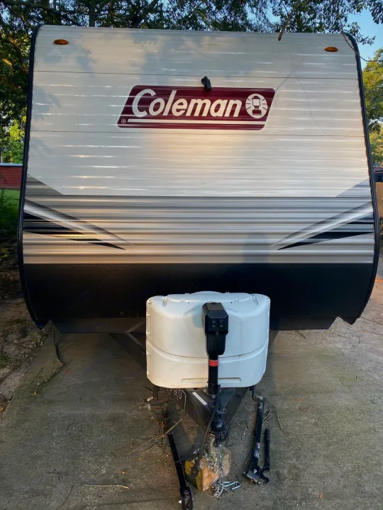 Front view of a white and gray Coleman travel trailer RV, ideal for your next rv rental adventure.. Coleman Lantern 2021