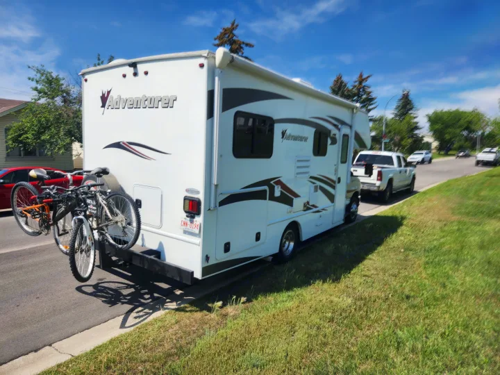 This white Adventurer RV rental with bikes attached is ready for a scenic road trip. A perfect motorhome for your next adventure.. Adventurer Adventurer Motorhome 2017