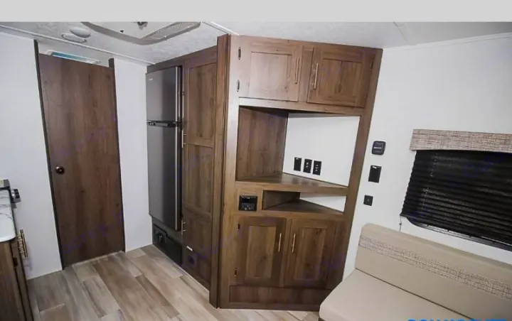 RV rental interior: fridge, wood cabinetry, entertainment center, dinette seating. Perfect for your next road trip.. Coachmen Viking 162RBU 2022