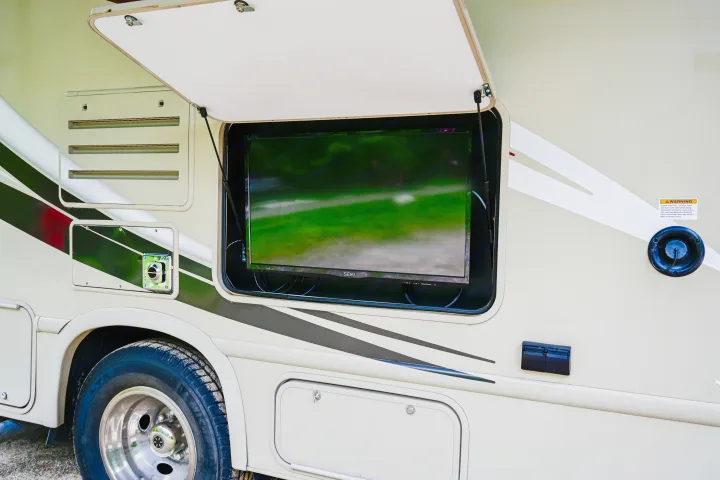 This RV rental features an open side compartment with a TV, perfect for outdoor entertainment on your adventure.. Thor Chateau 2017