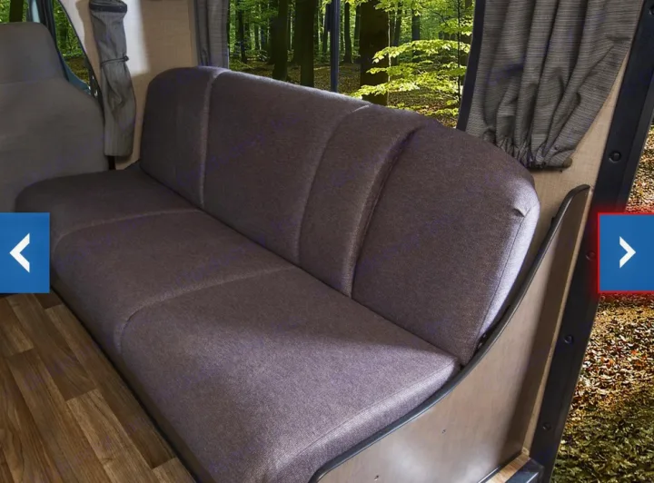 Step inside this RV rental! Enjoy forest views from the comfy grey bench seat.. Thor Majestic 2018