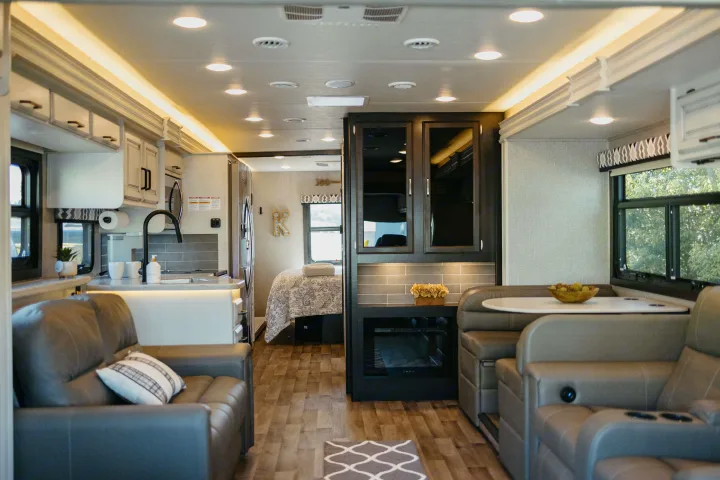 Explore this stylish RV rental interior featuring a well-appointed kitchen, comfortable living space, and private bedroom.. Entegra Coach Vision XL 2021