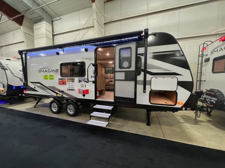 Step inside this sleek "Imagine" travel trailer at an RV show, a great option for your next rv rental.. Grand Design Imagine 2023