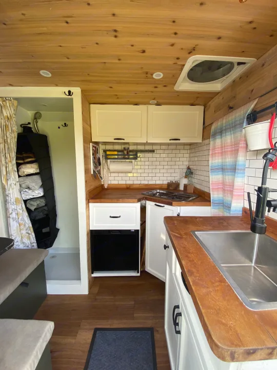 Explore this functional rv rental's compact kitchen with wood finishes, subway tile, and a clever multi-use shower space.. Other Other 2015