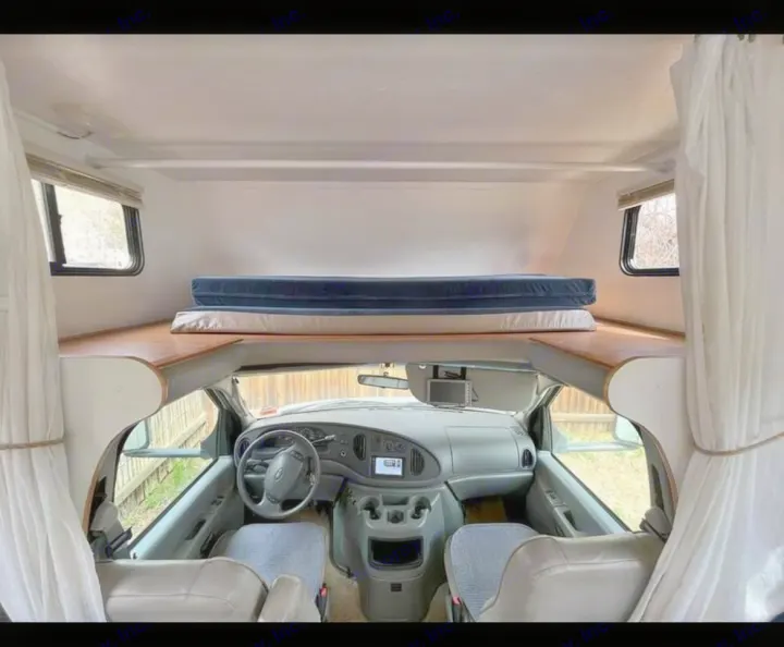 Driver and passenger seats. Loft with sleeping cushions. Forest River Sunseeker LE 2005