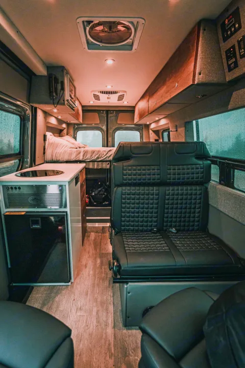 Explore compact luxury in this modern RV rental! View its integrated kitchen, comfy bed, and versatile seating for your next adventure.. Storyteller Overland Storyteller Overland Class B 2022