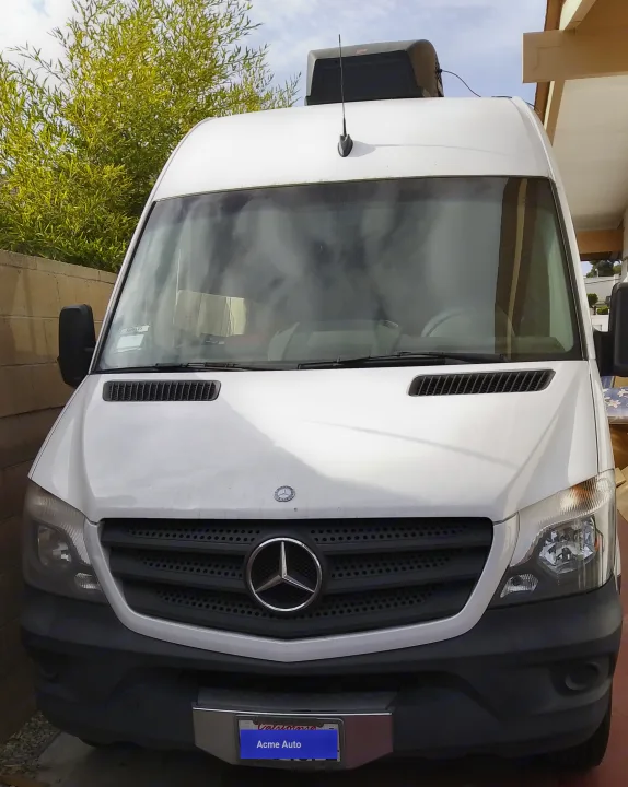 White Mercedes Sprinter van with rooftop unit, perfect for an RV rental.. Mercedes Benz Sprinter 2500 2014