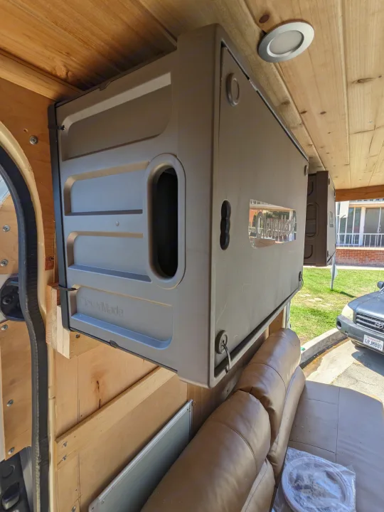 Inside an RV rental: CleverMade overhead storage, wood ceiling, and a comfortable brown sofa optimize space.. Mercedes Benz Sprinter 2500 2014