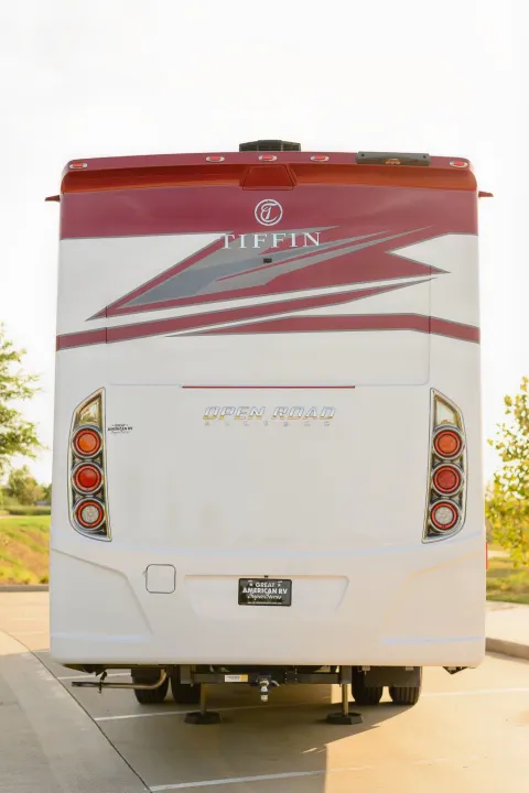 Rear view of a white and red Tiffin Allegro Open Road RV, ready for your next rv rental trip. Note the taillights and branding.. Tiffin Open Road 36UA 2023