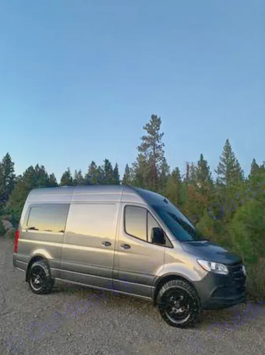 Gray Mercedes-Benz Sprinter van, ready for RV rental. Perfect for outdoor travel & camping adventures.. Mercedes-Benz Sprinter 2021