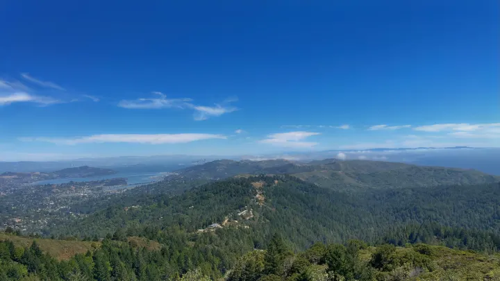Panoramic view of lush forests, San Francisco Bay, and distant city skyline from a mountain overlook. Plan your RV rental adventure here!. Toyota Tacoma 2017
