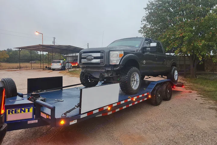 Dark Ford truck on a rental trailer. Find reliable transport services & more, like RV rental, here.. Custom 24ft Buggy Hauler 2023