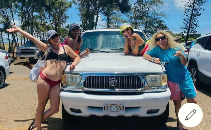 Happy friends posing with their car in Hawaii. Perfect day for fun travels and future adventures, like an RV rental!. Xplorer Explorer 2007
