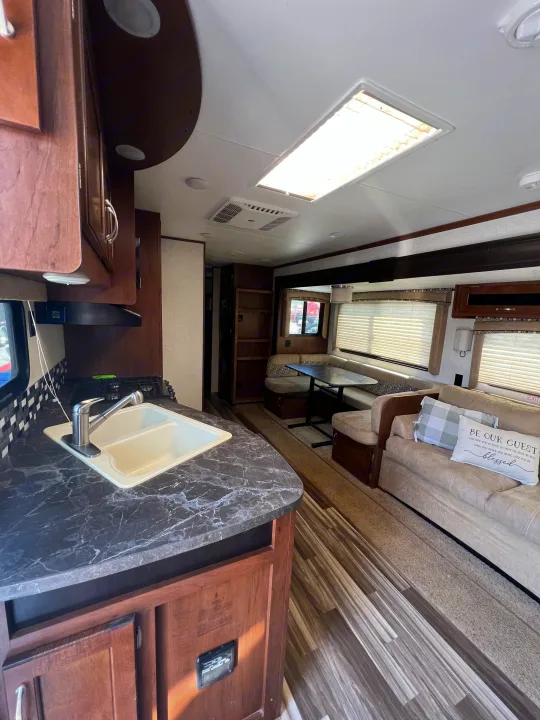 Spacious RV rental interior featuring a full kitchen, comfortable dinette, and cozy living area for travel.. Jayco Jay Flight 2017
