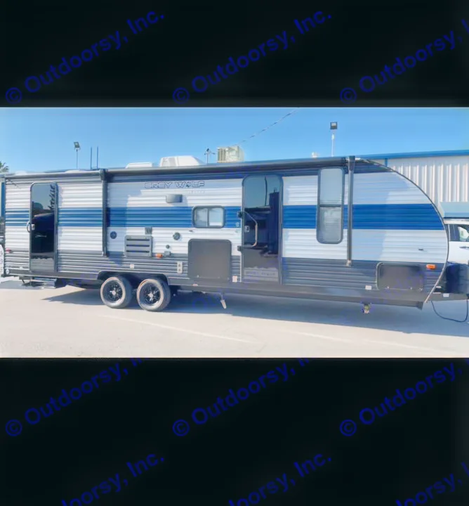 Ready for your next adventure: a large travel trailer RV rental, the Grey Wolf Limited, parked under a clear sky.. Forest River Cherokee Grey Wolf 2021