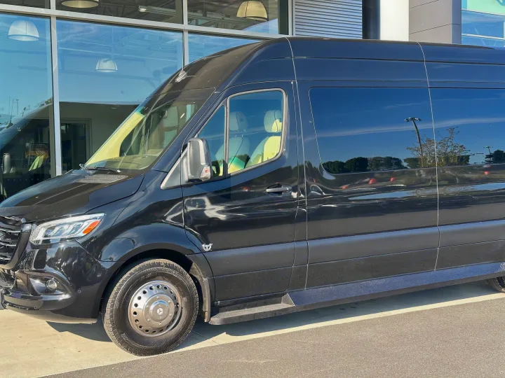 Black Mercedes-Benz Sprinter van for RV rental, with tinted windows and visible luxury interior.. Ultimate Toys Ultimate Coach 2024