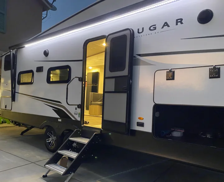 Brightly lit Cougar RV rental shows off its spacious interior and accessible exterior storage, ready for any adventure.. Keystone RV Cougar 2023
