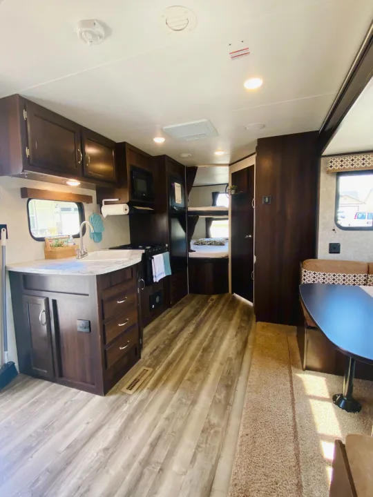 Spacious RV rental interior features a full kitchen, dinette, and bunk beds, ready for your next adventure.. Jayco Jay Flight SLX 2018