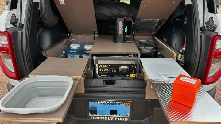 Custom truck bed camping kitchen with kettle, water, and storage. Ideal for an RV rental or overland adventures.. Ford Bronco Sport 2022