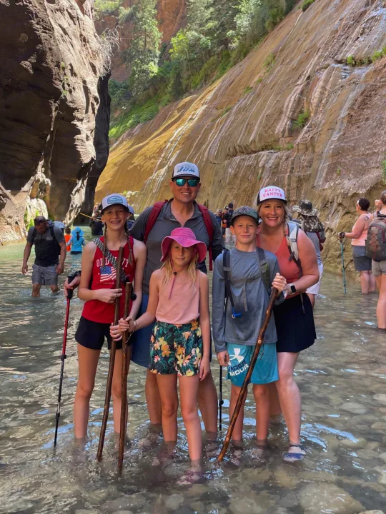 A family of five enjoys a river hike in a breathtaking canyon. An RV rental opens doors to exploring amazing natural wonders!. Forester Classic 2021
