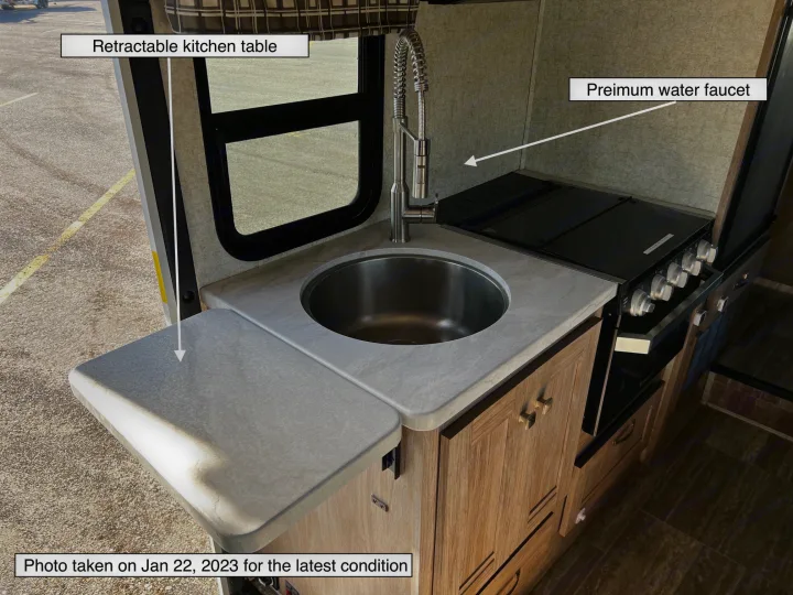 RV rental kitchen highlights: premium faucet, sink, stove, and a versatile retractable kitchen table.. Forest River Sunseeker LE 2020