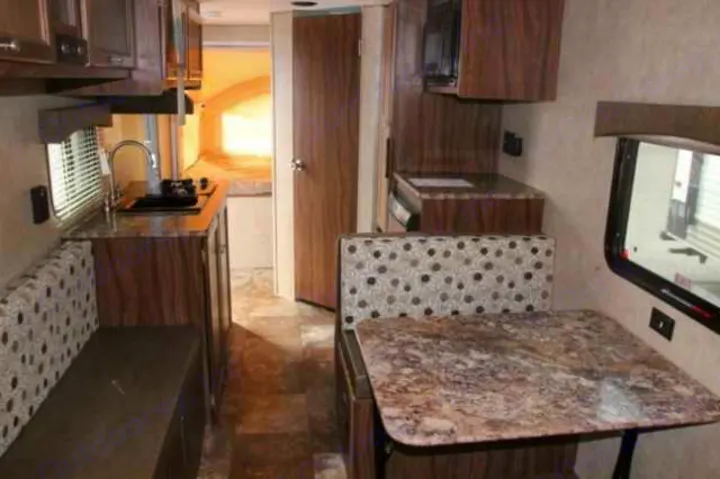 This rv rental interior features a compact kitchen with sink/microwave, a dinette table, and bench seating.. Clipper Clipper Trailer 2016