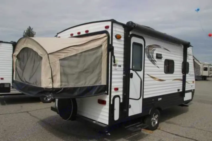 Spacious white hybrid RV rental with an expanded rear tent section, perfect for family camping.. Clipper Clipper Trailer 2016
