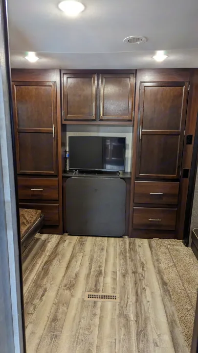 Step inside this inviting RV rental. Features include rich wood cabinetry, a mounted TV, and a clever folding table, all on plank flooring.. Jayco Jay Flight 2019