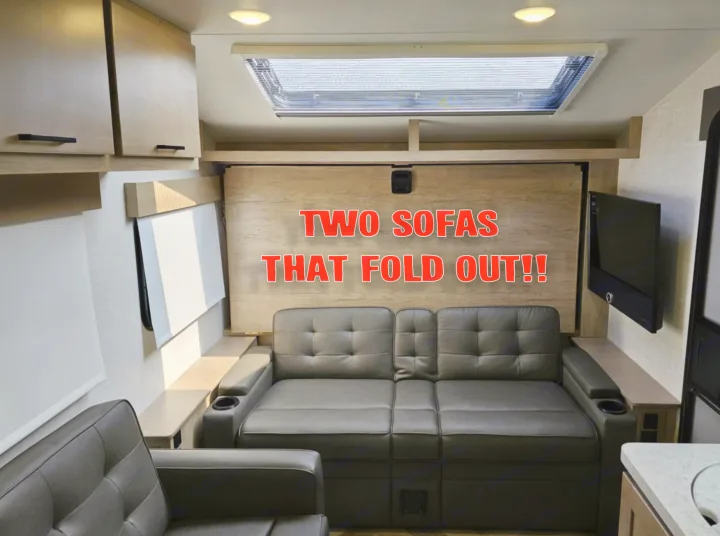 Comfortable RV rental interior with two sofas that fold out for versatile living and sleeping.. Ember Overland 2022