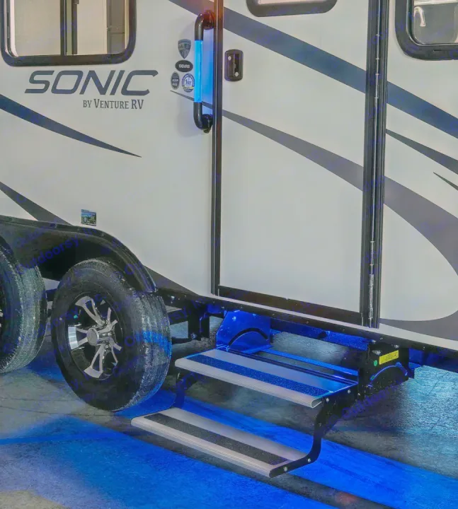 Night view of an RV rental: blue LED lighting on the entry steps and door handle for enhanced visibility and style.. Sonic Sonic Trailer 2019