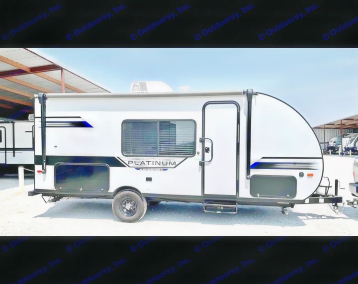 This sleek white single-axle travel trailer, available for **rv rental**, features an awning & dark accents, ready for adventure.. Forest River Salem FSX PLATINUM 2021