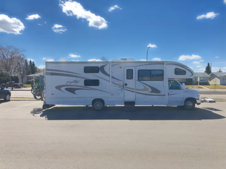 White Jayco Greyhawk Class C motorhome, with bikes on back. Great for rv rental travel and adventures!. Jayco Greyhawk 2010