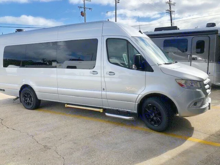 Modern silver Xalta RV rental van parked on pavement, ready for travel.. CLASS B 2022