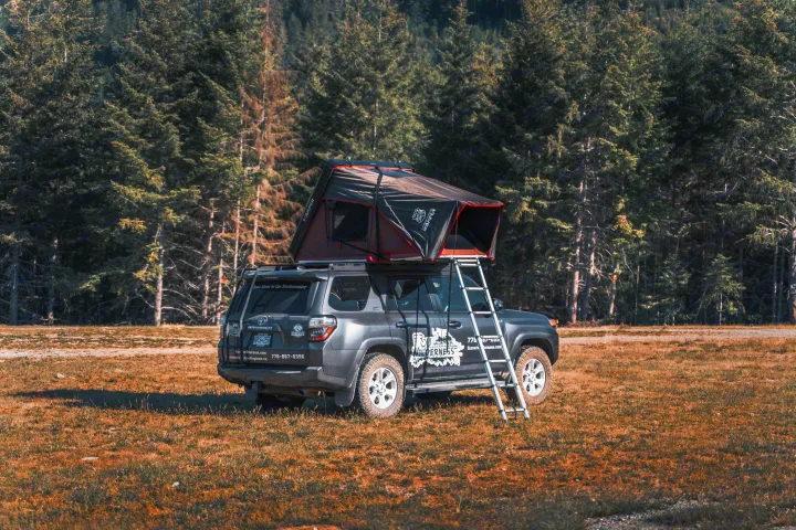 Explore with this unique RV rental: a Toyota 4Runner with a deployed iKamper rooftop tent, perfect for outdoor camping adventures.. Toyota 4Runner 2021