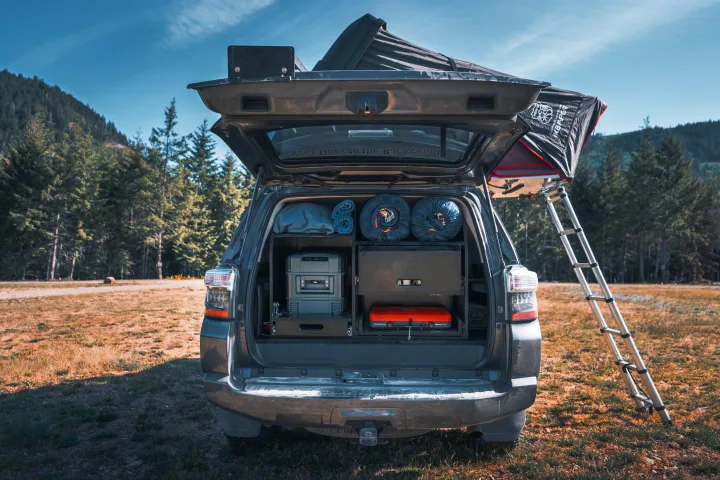 Explore with this RV rental! SUV features rooftop tent & custom tailgate setup: fridge, storage, camp stove.. Toyota 4Runner 2021