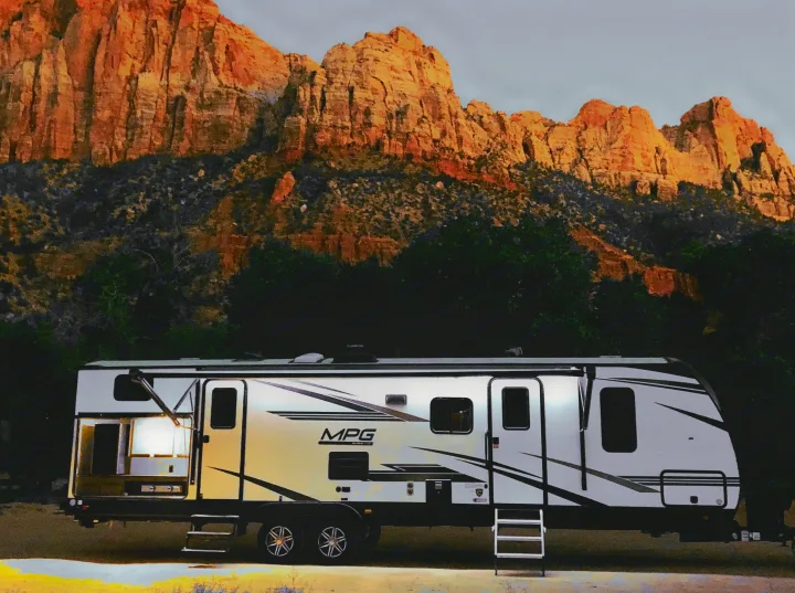Front side with awning and outdoor kitchen. Cruiser RV MPG 2022