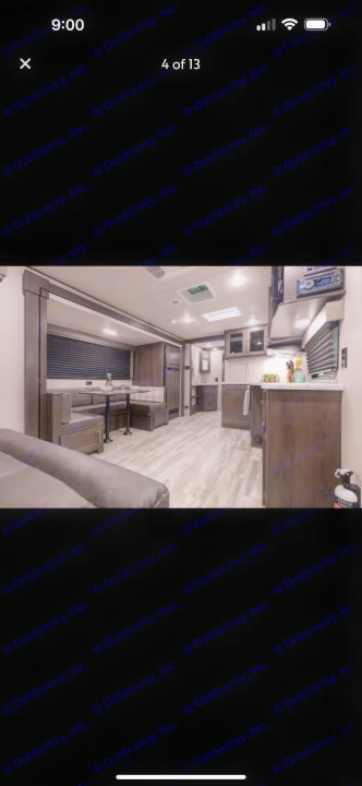 Spacious rv rental interior featuring a modern kitchen, dining booth, and comfortable living area with light wood flooring.. Grand Design Transcend Xplor 2021