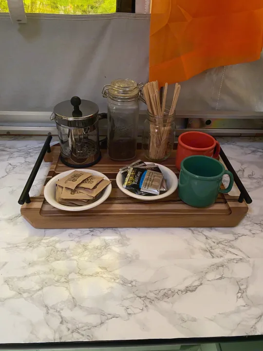 Coffee & tea setup in an RV rental: French press, mugs, and supplies for a cozy morning while camping.. Viking Recreational Vehicles, INC. Model 548 2000