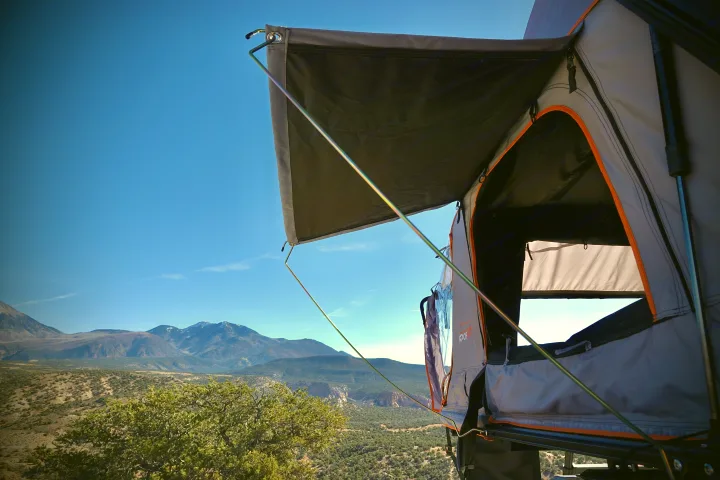Scenic mountain view from an RV rental's rooftop tent, perfect for camping and outdoor adventures.. toyota tacoma trd 4x4 2018