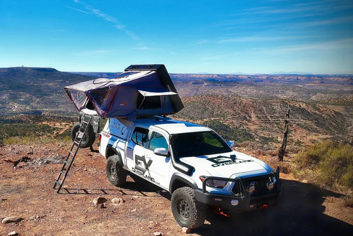 Overland RV rental: White Toyota Tacoma 4x4 with a rooftop tent, ready for desert adventures & off-road camping.. toyota tacoma trd 4x4 2018