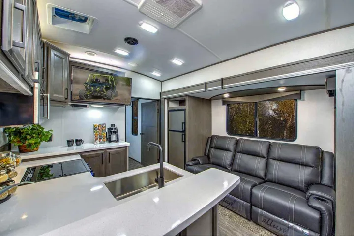 Experience a modern RV rental featuring a full kitchen, living space with a comfy sofa, and scenic views.. Cruiser Rv Corp Stryker 2022